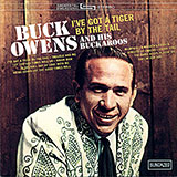 Download or print Buck Owens I've Got A Tiger By The Tail Sheet Music Printable PDF -page score for Country / arranged Real Book – Melody, Lyrics & Chords SKU: 885555.