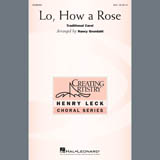 Download or print Traditional Carol Lo, How A Rose (arr. Nancy Grundahl) Sheet Music Printable PDF -page score for Christmas / arranged SSA Choir SKU: 407588.